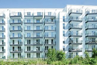 Facade view with balconies of the Tassiloplatz residential neighbourhood in Munich.