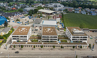 Aerial view of a Brownfield project in Switzerland with a mixed-use building.